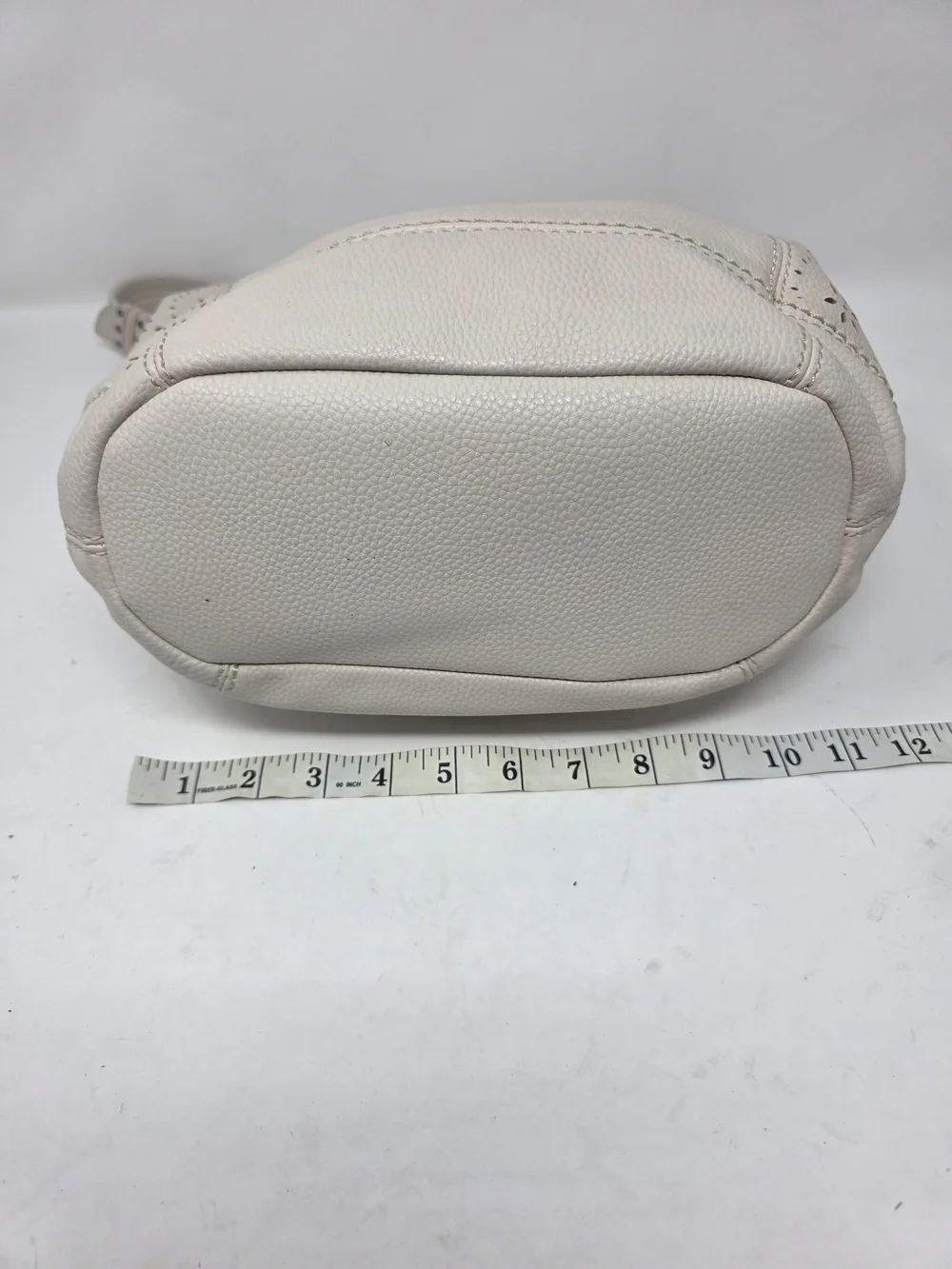​The Sak Off White Pebbled Leather Hobo Bag Perforated Cutout Tassel